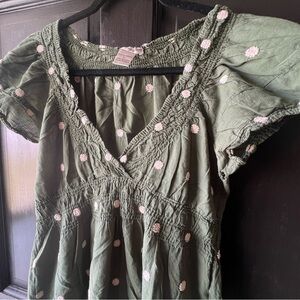 Green sundress with embroidered design